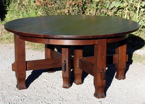 Vintage early 8 leg 60 in stretcher base dining table with 5 leaves opens to 10 ft Stickley era